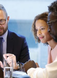 financial-advisor-having-a-meeting-with-clients-1063753064-c799ed7b34b945e79e548b62e90fdd83